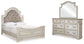 Realyn Queen Upholstered Panel Bed with Mirrored Dresser